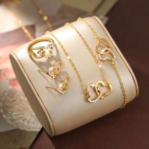 Ensemble de bijoux chic et romantique pour femmes avec une forme de cœur, comprenant un collier, un anneau, deux boucles d'oreilles et un bracelet, parfait pour les femmes élégantes